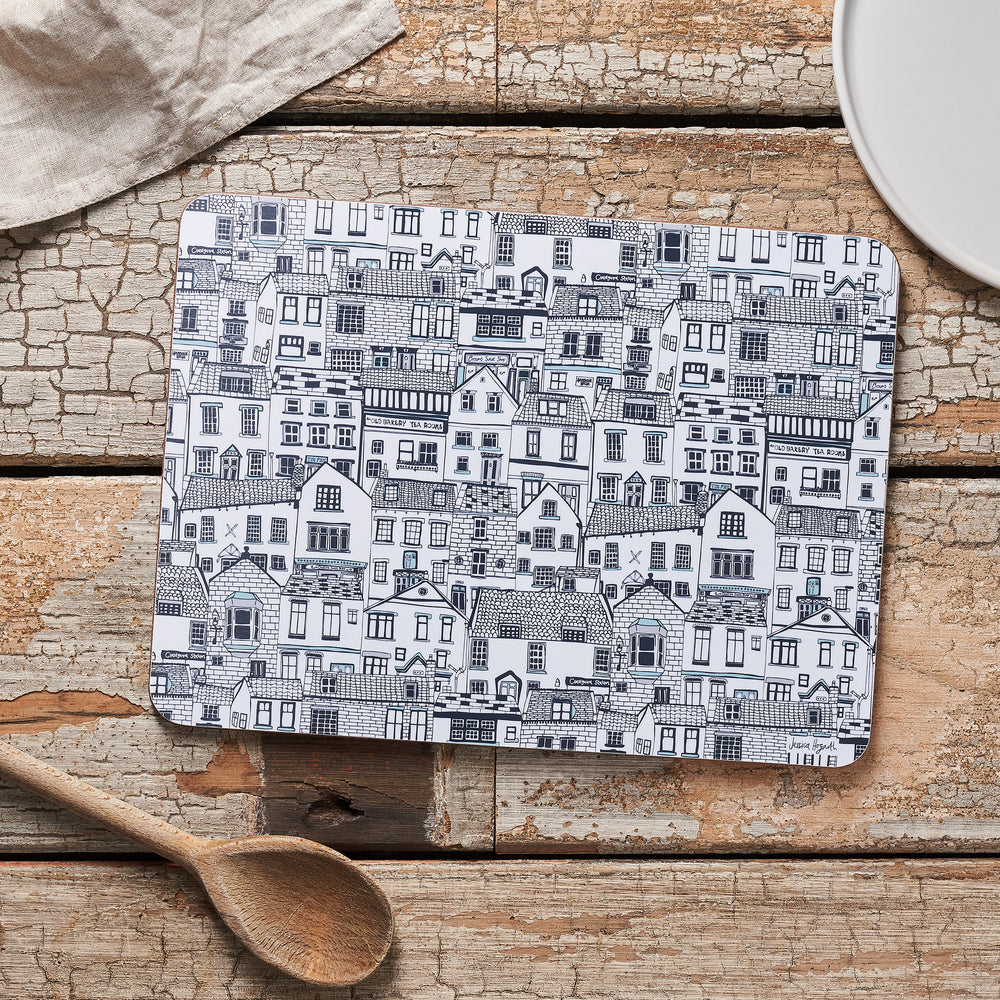 Melamine and cork seaside placemats with illustrated cottages design