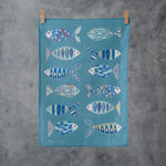 A blue fish tea towel from Jessica Hogarth Shop